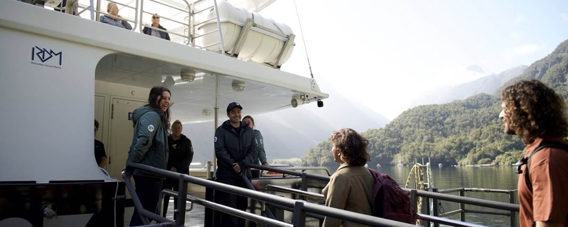 Guests are welcomed onboard a RealNZ vessel by the friendly crew